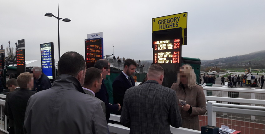 bookies paying out winning bets at cheletnham racecourse