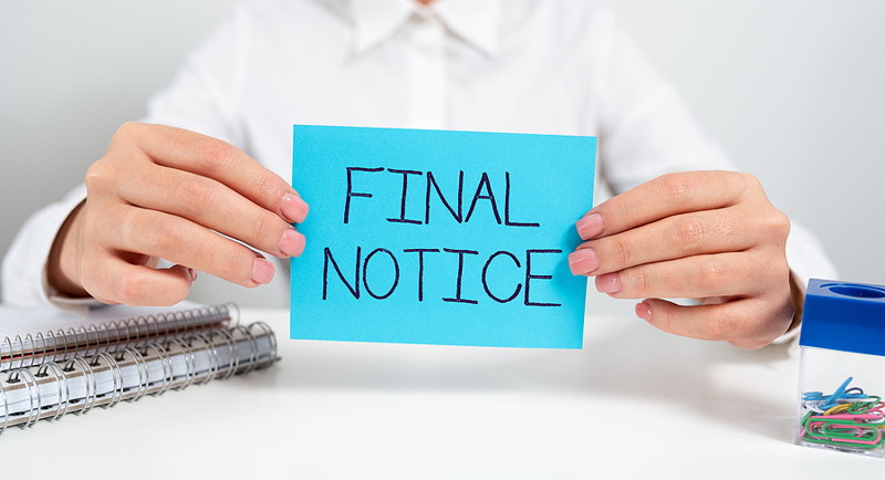 final notice sign being held up