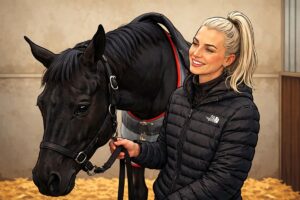 rebecca curtis with horse in stable illustration